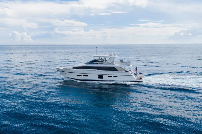 Slide: The Image of 2018 Hatteras M75 Panacera yacht cruising on open ocean under clear skies. - 6