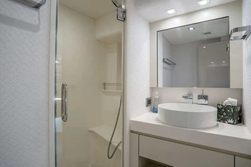 Slide: The Image of Luxurious bathroom in 2018 Hatteras M75 Panacera yacht, featuring modern sink and shower. - 49