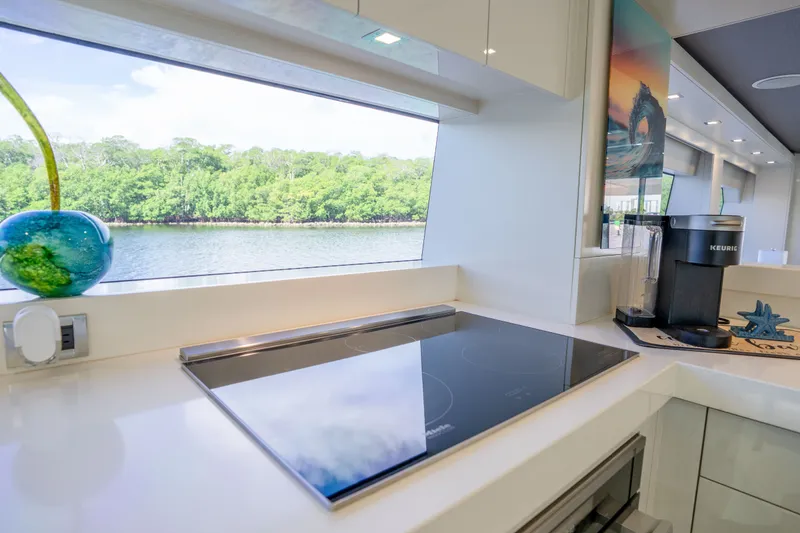 Slide: The Image of Modern kitchen interior of 2018 Hatteras M75 Panacera yacht with scenic water view. - 37