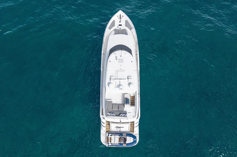 Slide: The Image of Aerial view of 2018 Hatteras M75 Panacera yacht on clear blue water. - 8