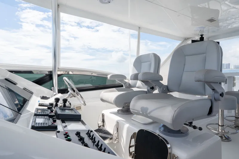 Slide: The Image of Luxurious helm of 2018 Hatteras M75 Panacera yacht with modern controls and seating. - 17
