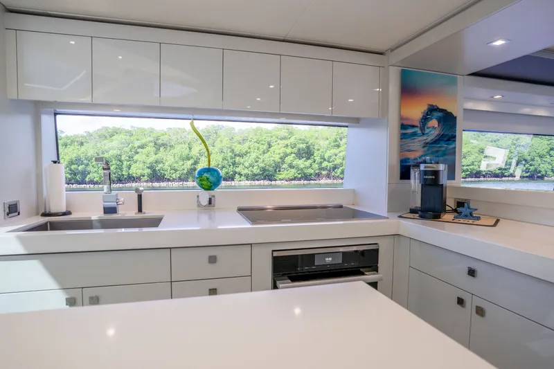 Slide: The Image of Modern kitchen interior of 2018 Hatteras M75 Panacera yacht with scenic window view. - 35