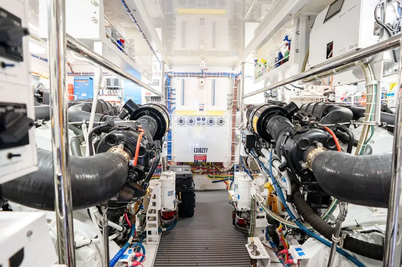 Slide: The Image of Engine room of 2018 Hatteras M75 Panacera yacht, showcasing advanced machinery and equipment. - 60