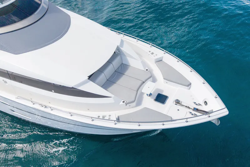 Slide: The Image of 2018 Hatteras M75 Panacera yacht bow on clear blue water. - 4