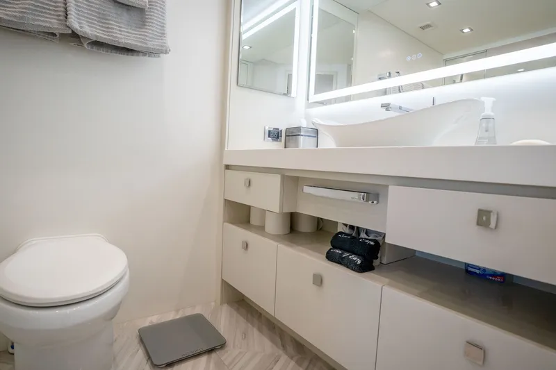 Slide: The Image of Luxurious bathroom in 2018 Hatteras M75 Panacera yacht with modern fixtures and elegant design. - 44