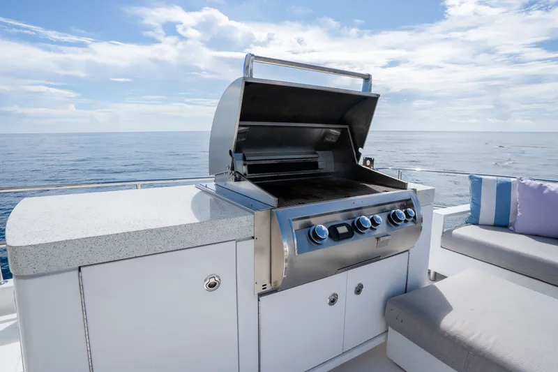 Slide: The Image of Outdoor grill on 2018 Hatteras M75 Panacera yacht with ocean view. - 12