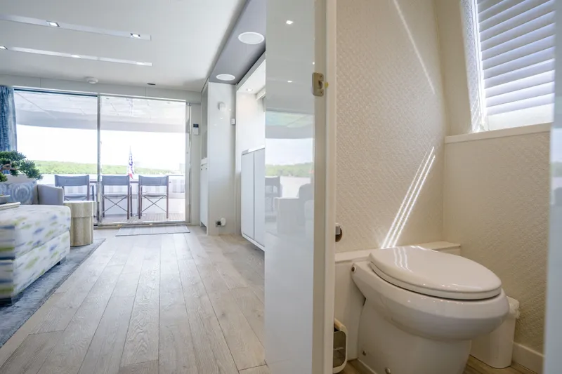 Slide: The Image of Luxurious interior of 2018 Hatteras M75 Panacera yacht with modern bathroom and spacious living area. - 32