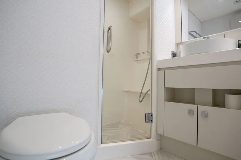 Slide: The Image of Luxurious bathroom in 2018 Hatteras M75 Panacera yacht with modern fixtures and shower. - 48