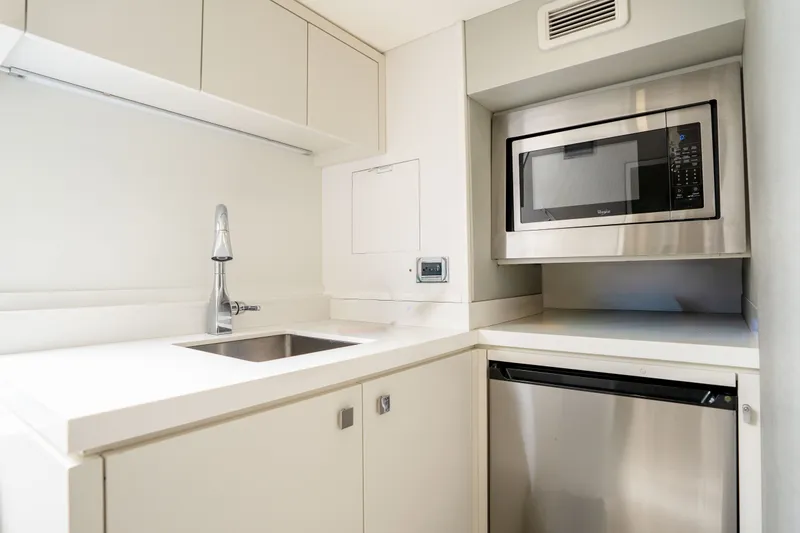Slide: The Image of Modern kitchen in 2018 Hatteras M75 Panacera yacht with stainless steel appliances. - 56