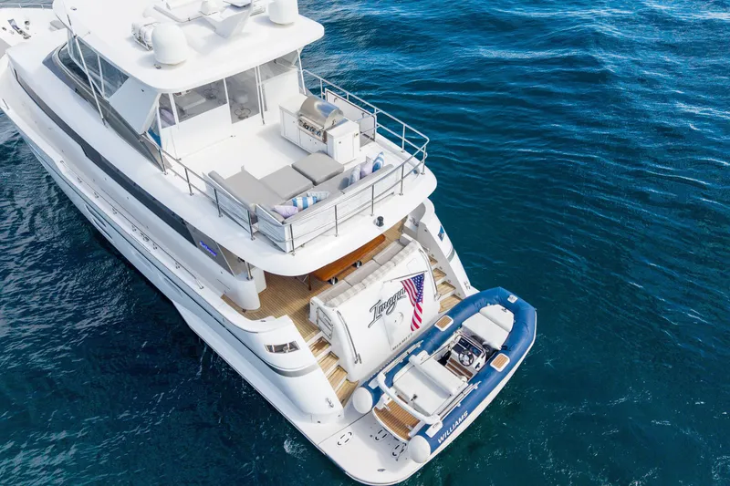 Slide: The Image of Luxurious 2018 Hatteras M75 Panacera yacht with tender on open sea. - 5