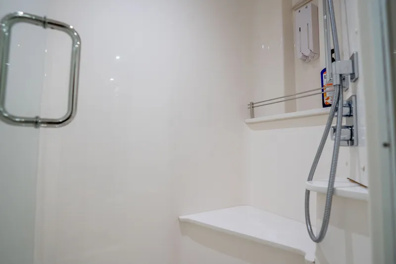 Slide: The Image of Shower area in 2018 Hatteras M75 Panacera yacht, featuring sleek design and modern fixtures. - 54