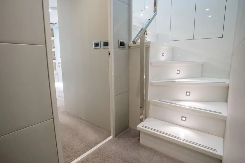 Slide: The Image of Elegant interior staircase of 2018 Hatteras M75 Panacera yacht with modern lighting. - 41