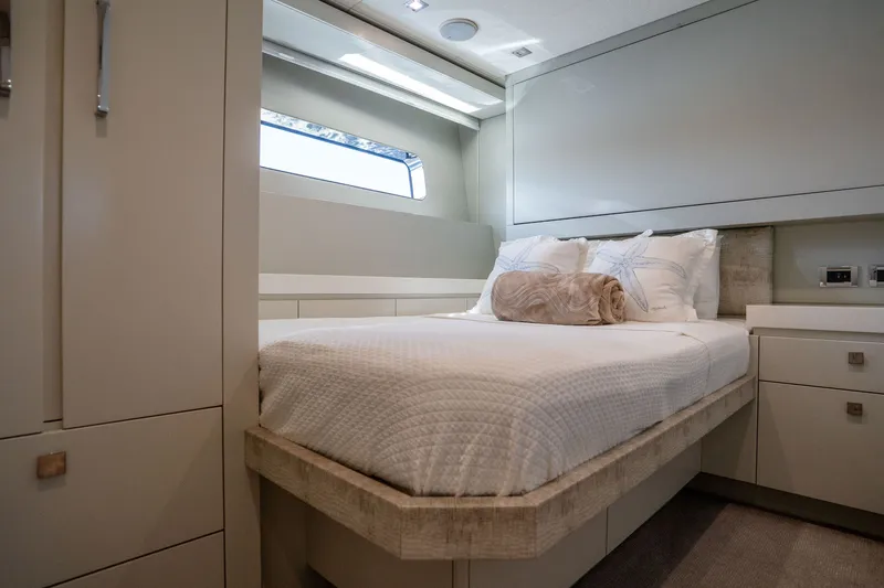 Slide: The Image of Luxurious bedroom interior of 2018 Hatteras M75 Panacera yacht with modern design and cozy bedding. - 50
