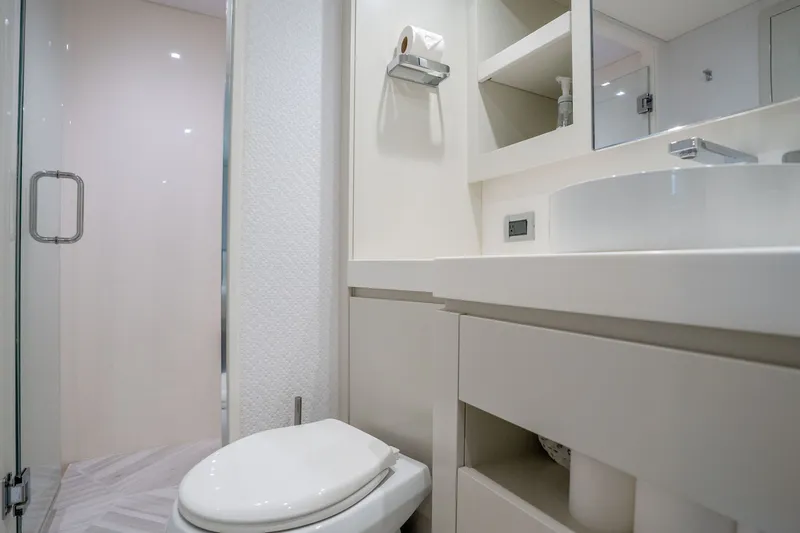 Slide: The Image of Luxurious bathroom interior of 2018 Hatteras M75 Panacera yacht, featuring modern fixtures and elegant design. - 52