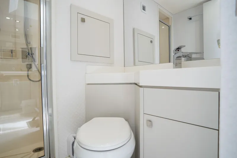 Slide: The Image of Modern bathroom interior on 2018 Hatteras M75 Panacera yacht, featuring sleek fixtures and shower. - 58