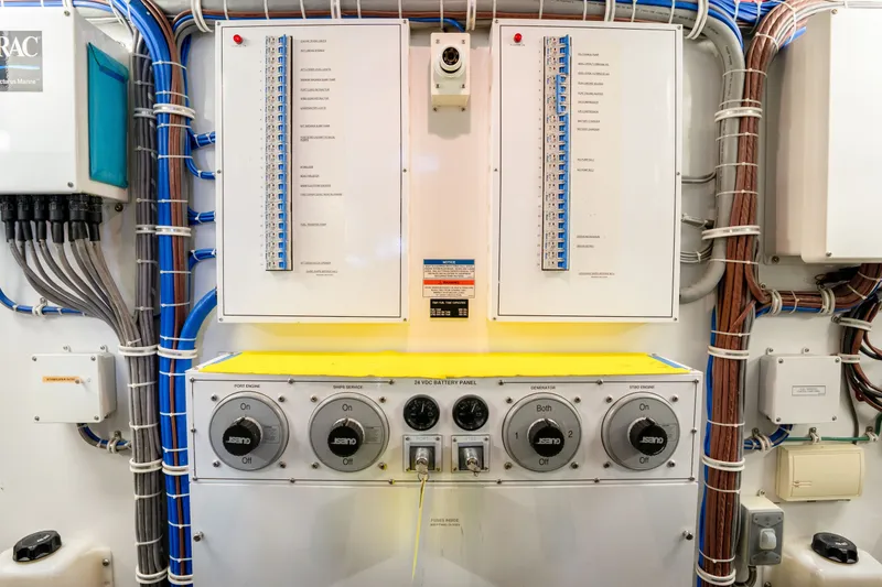 Slide: The Image of Electrical panel of 2018 Hatteras M75 Panacera yacht, featuring switches and wiring. - 63