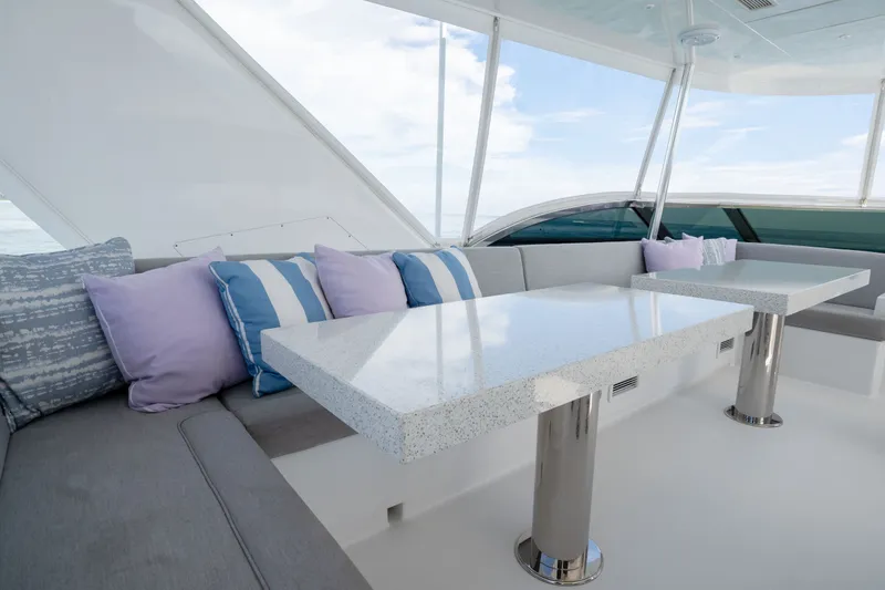 Slide: The Image of Luxurious interior of 2018 Hatteras M75 Panacera yacht with elegant seating and tables. - 16