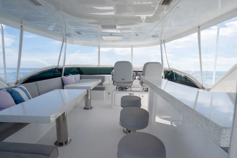 Slide: The Image of Luxurious interior of 2018 Hatteras M75 Panacera yacht with modern seating and ocean view. - 13