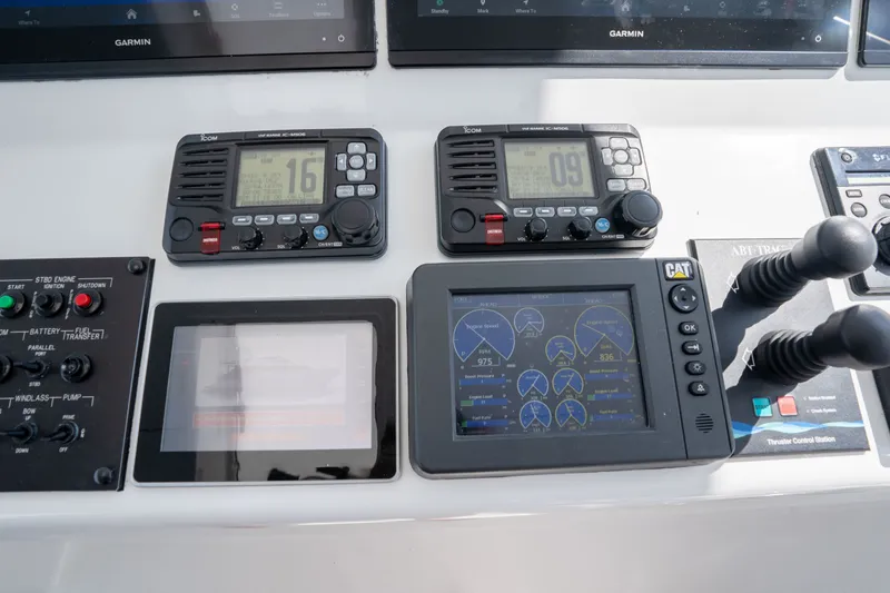 Slide: The Image of Control panel of 2018 Hatteras M75 Panacera yacht with navigation and communication equipment. - 20