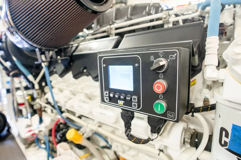 Slide: The Image of Engine room of 2018 Hatteras M75 Panacera yacht with control panel and components. - 61