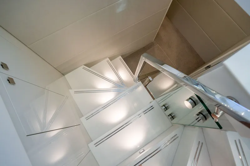 Slide: The Image of Staircase inside 2018 Hatteras M75 Panacera yacht, featuring sleek modern design and lighting. - 40