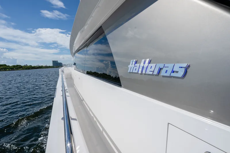 Slide: The Image of Side view of 2018 Hatteras M75 Panacera yacht cruising on a sunny day. - 26
