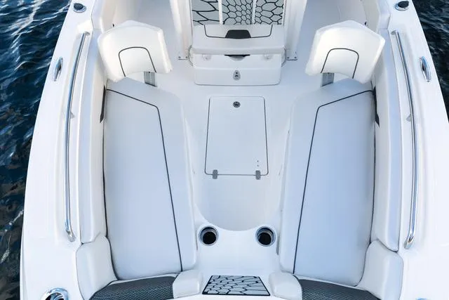 Slide: The Image of 2023 Wellcraft 222F boat interior with sleek white seating and modern design. - 17