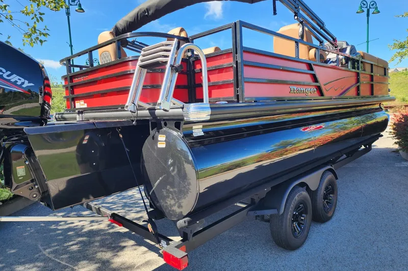 Slide: The Image of 2027 Ranger Pontoon 223FC with red and black design on a trailer. - 10