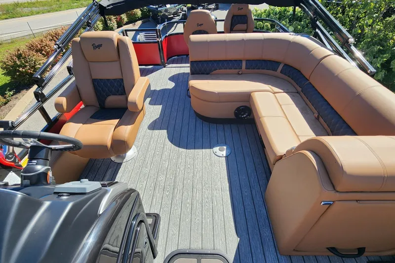 Slide: The Image of 2027 Ranger Pontoon 223FC interior with tan seating and modern design. - 6