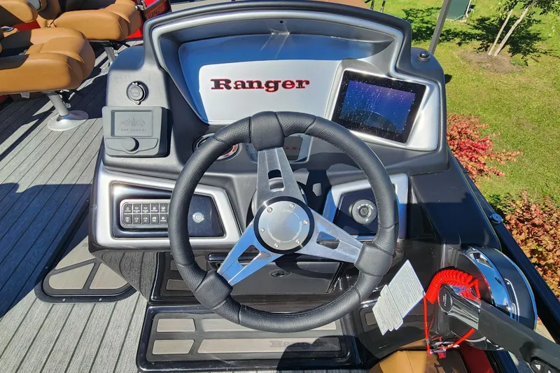 Slide: The Image of Steering console of 2027 Ranger Pontoon 223FC with modern controls and display. - 2