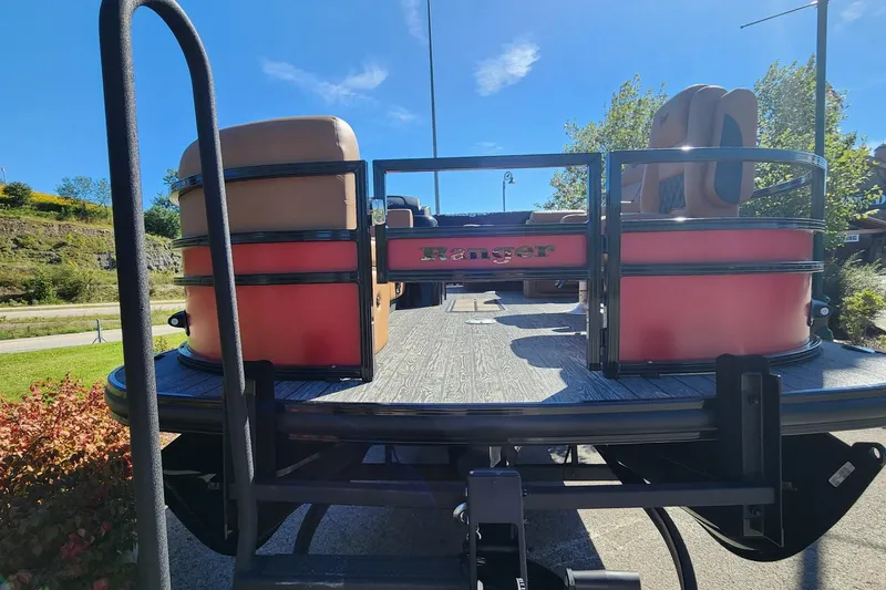 Slide: The Image of 2027 Ranger Pontoon 223FC on trailer, sunny day, outdoor setting. - 11