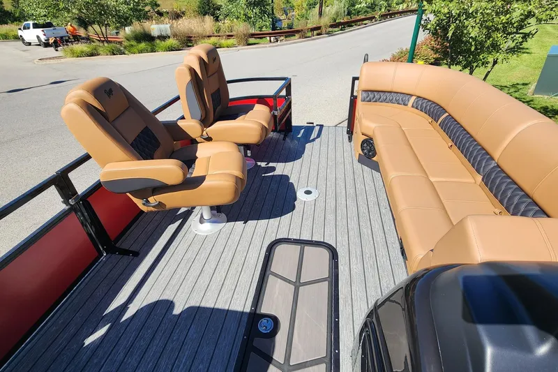 Slide: The Image of 2027 Ranger Pontoon 223FC interior with tan seating and spacious deck layout. - 7