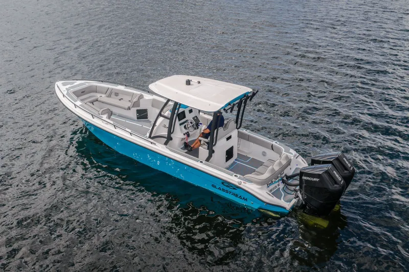 Slide: The Image of 2024 Glasstream 32 GSX boat on water, featuring dual Mercury engines. - 7