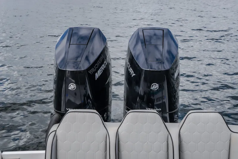 Slide: The Image of 2024 Glasstream 32 GSX boat with dual Mercury Verado engines on water. - 53