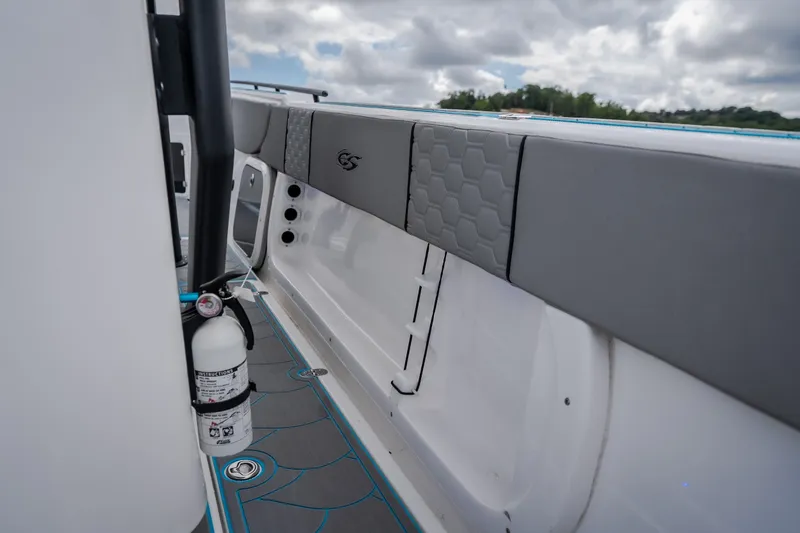 Slide: The Image of 2024 Glasstream 32 GSX boat interior with gray seating and fire extinguisher. - 29