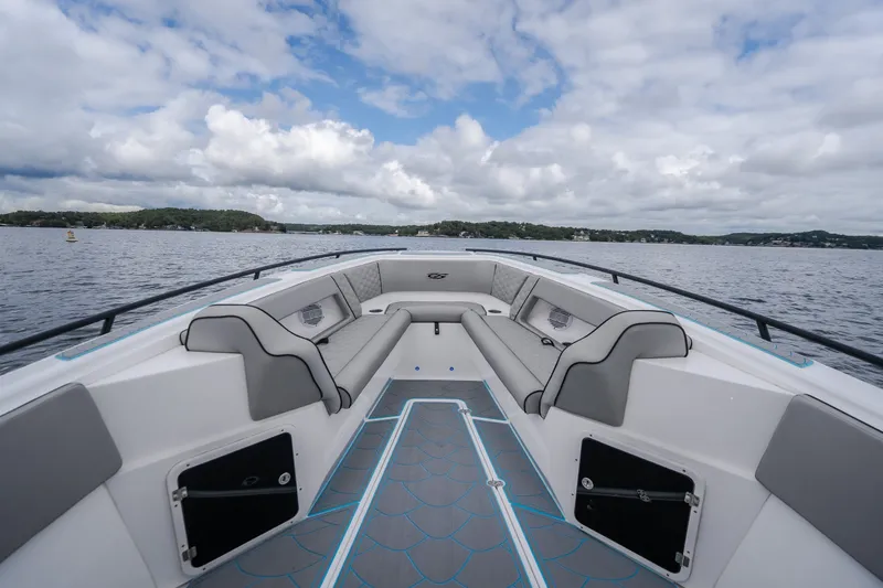 Slide: The Image of 2024 Glasstream 32 GSX boat interior with spacious seating on a scenic lake. - 35