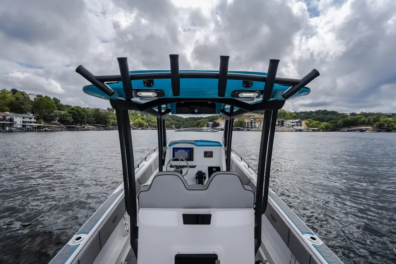Slide: The Image of 2024 Glasstream 32 GSX boat on a scenic lake with cloudy skies. - 48