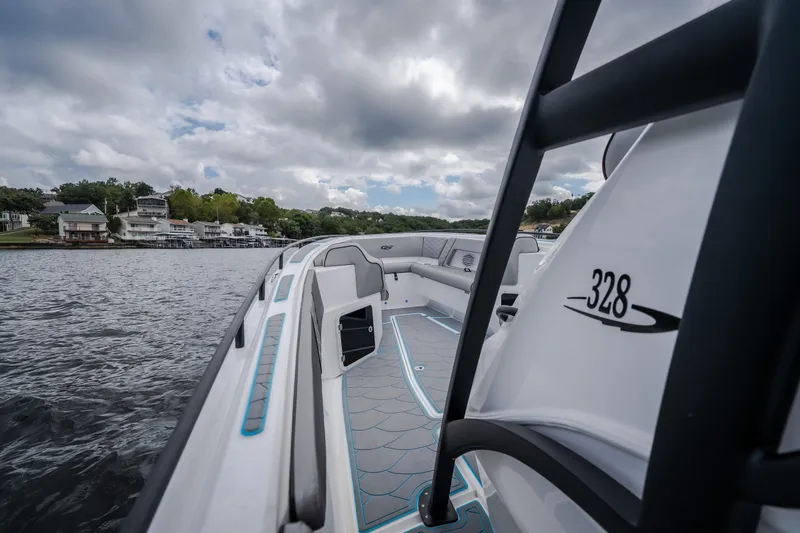 Slide: The Image of 2024 Glasstream 32 GSX boat on water, showcasing sleek design and spacious deck. - 27