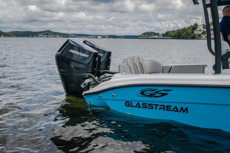 Slide: The Image of 2024 Glasstream 32 GSX boat with Mercury engines on a scenic lake. - 18