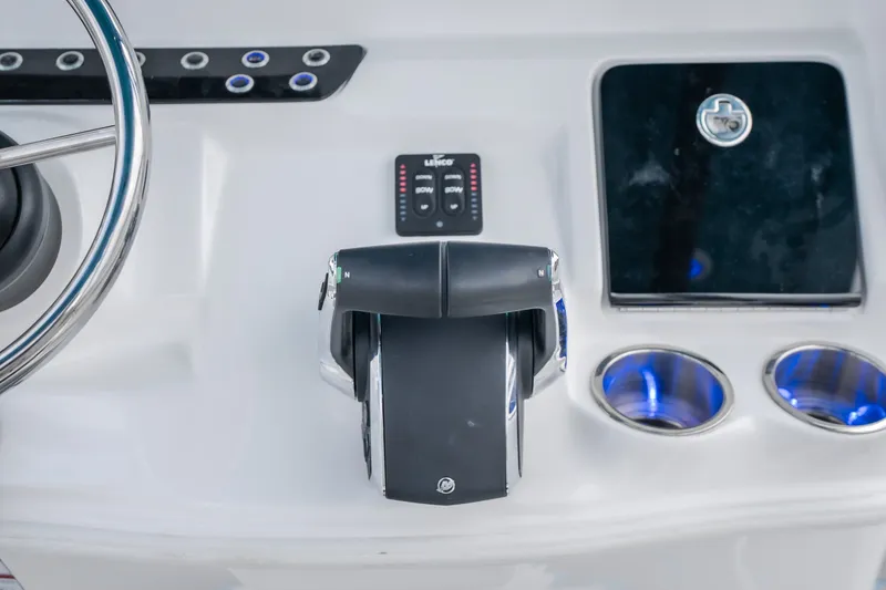 Slide: The Image of 2024 Glasstream 32 GSX boat dashboard with steering wheel and control panel. - 51