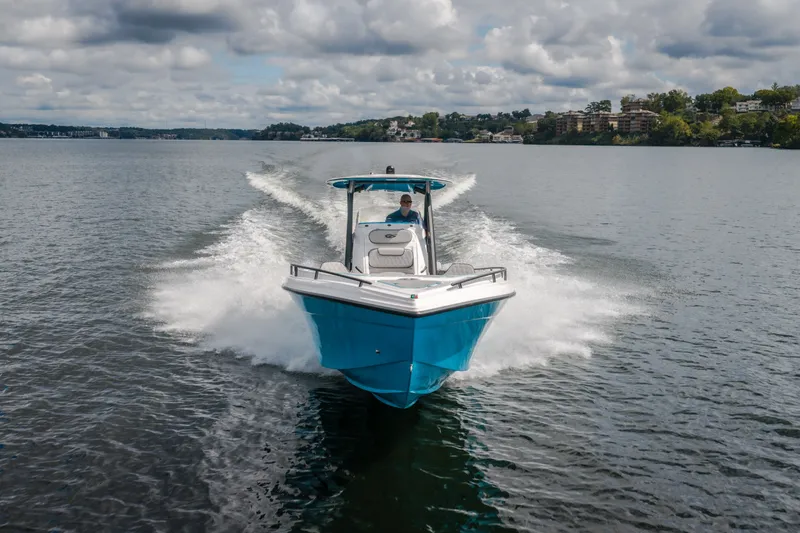 Slide: The Image of 2024 Glasstream 32 GSX boat cruising on a lake under cloudy skies. - 58