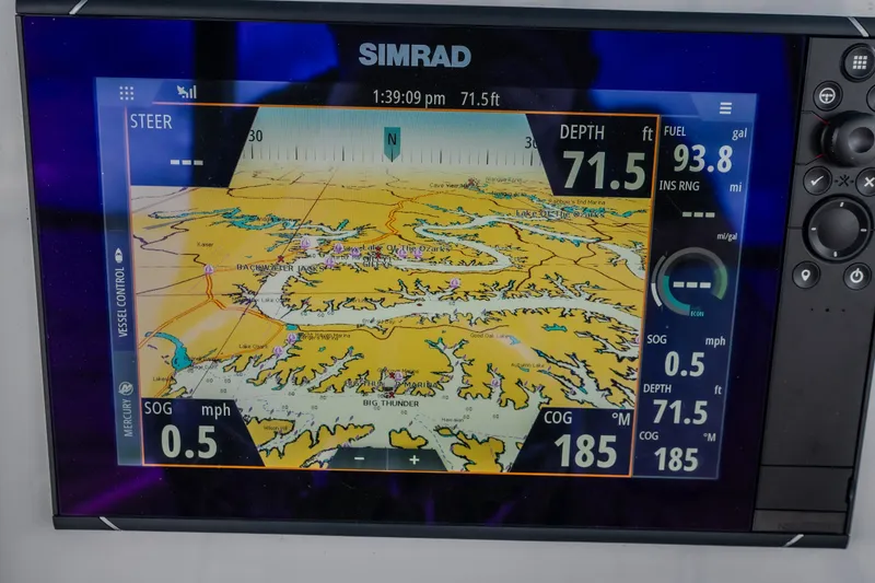 Slide: The Image of Simrad navigation display on 2024 Glasstream 32 GSX, showing depth and fuel data. - 54