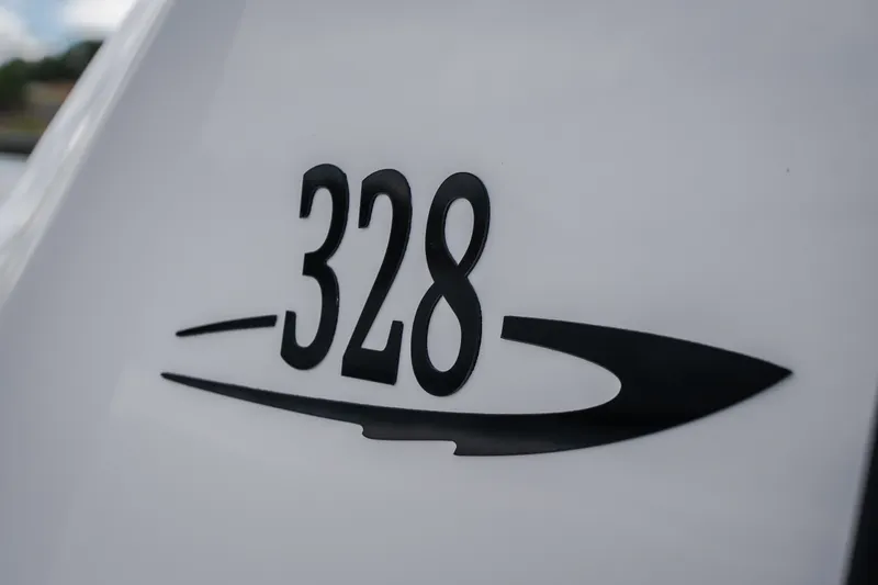 Slide: The Image of 2024 Glasstream 32 GSX boat emblem with sleek design on white surface. - 28