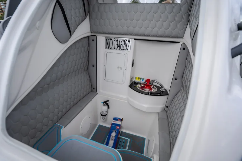 Slide: The Image of 2024 Glasstream 32 GSX cabin interior with sink and storage area. - 24