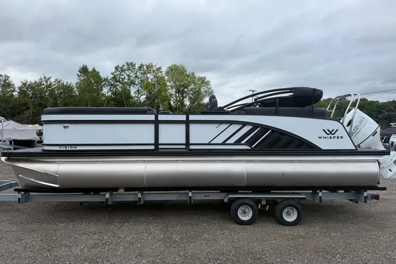 Slide: The Image of 2027 Whisper VISION RLS 23V pontoon boat on trailer, parked outdoors. - 22