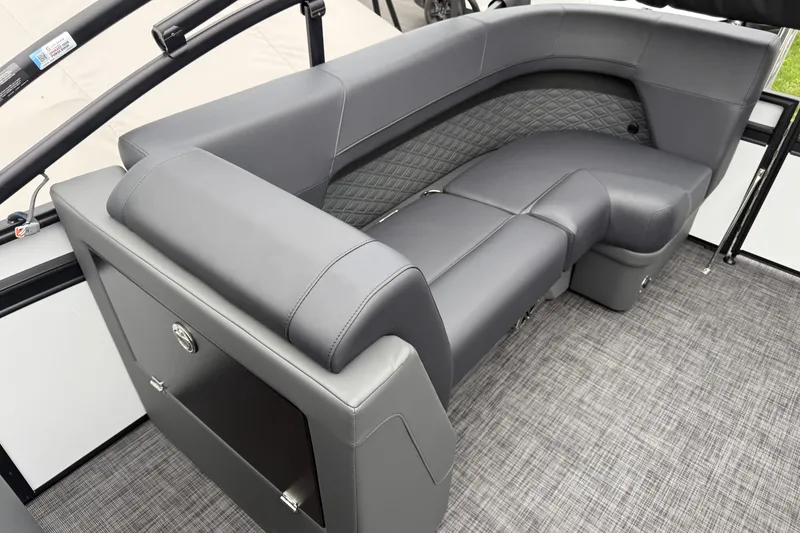 Slide: The Image of Luxurious seating on Whisper VISION RLS 23V boat, 2027 model, with sleek gray upholstery. - 27