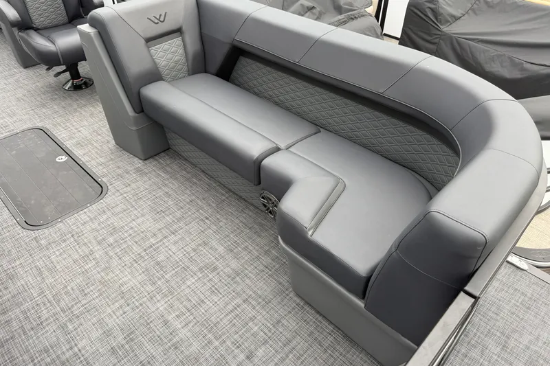 Slide: The Image of Luxurious seating in Whisper VISION RLS 23V boat, 2027 model, featuring sleek gray upholstery. - 15