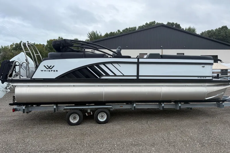 The Image of 2027 Whisper VISION RLS 23V pontoon boat on trailer, parked outdoors. - 1