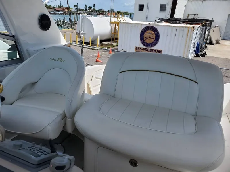 Slide: The Image of 2002 Sea Ray 310 Sundancer boat interior with white leather seating. - 12