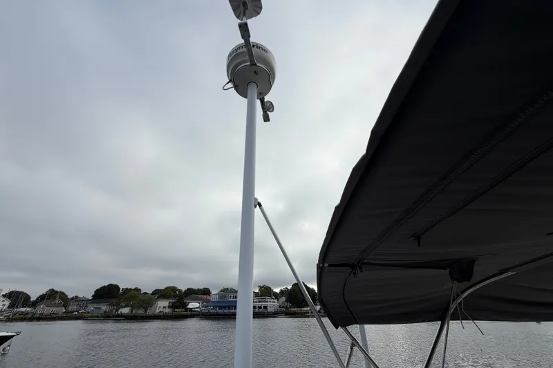 Slide: The Image of Sailboat mast and canopy on a 1998 Catalina 380, with waterfront view. - 33